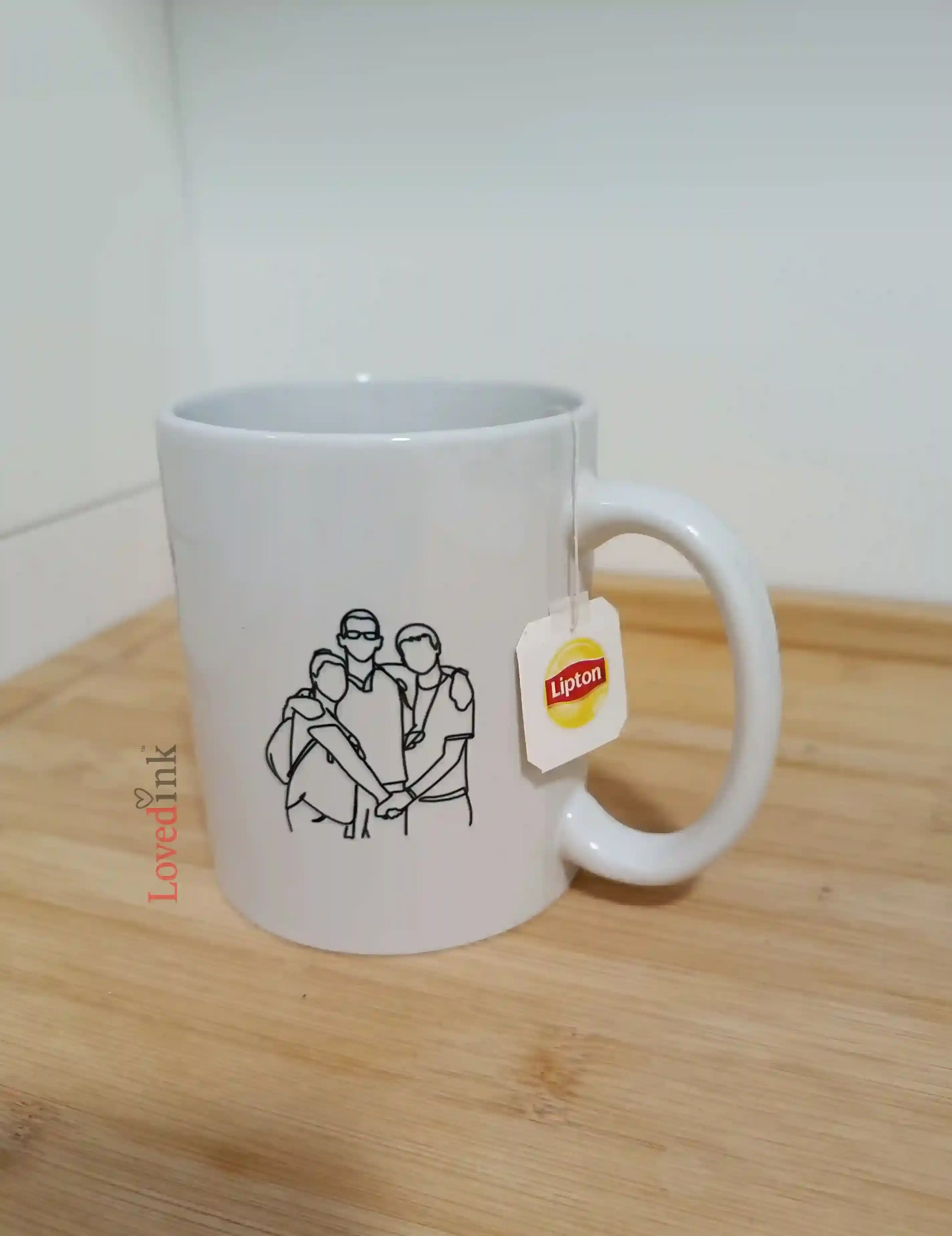 White Lovedink mug with a printed design and Lipton tag on a wooden, Gift 