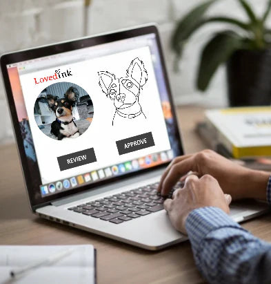 Person using a laptop to review the drawing. Lovedink