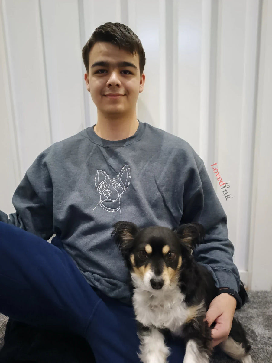 Young man with Border Collie wearing grey custom embroidered sweatshirt with minimalist dog line art (Lovedink)