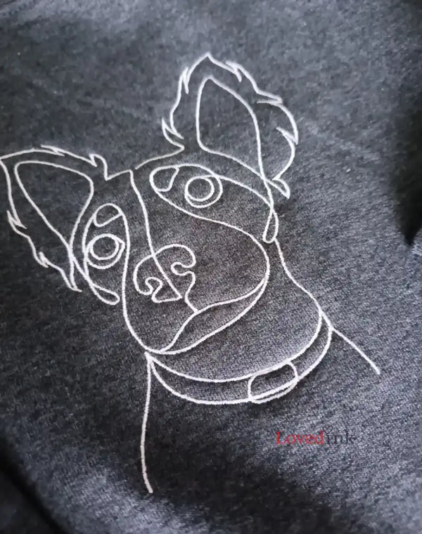 Light blue embroidered sweatshirts featuring minimalist single line dachshund portrait custom made from customer pet photo