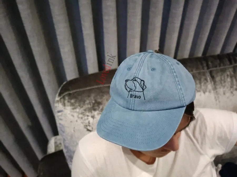 Side view of light blue custom embroidered cap with minimalist dog line art (Lovedink)