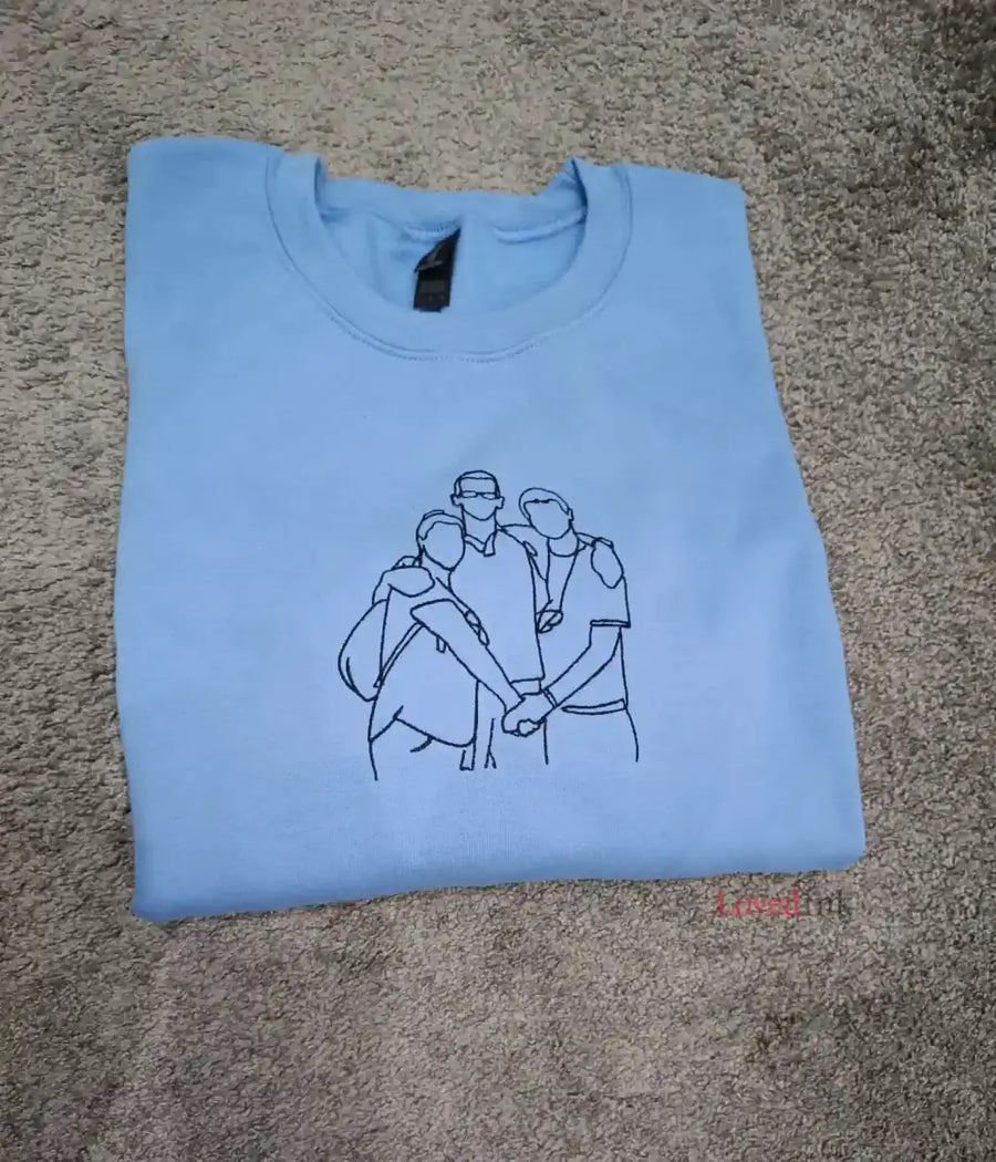 Light blue custom embroidered sweatshirt with minimalist family portrait line art — personalized gift (Lovedink)