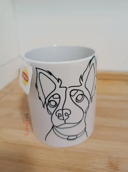 White mug with custom minimalist line art print on wooden table (Lovedink)