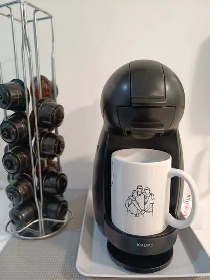 Custom line art mug on kitchen counter beside coffee machine (Lovedink)