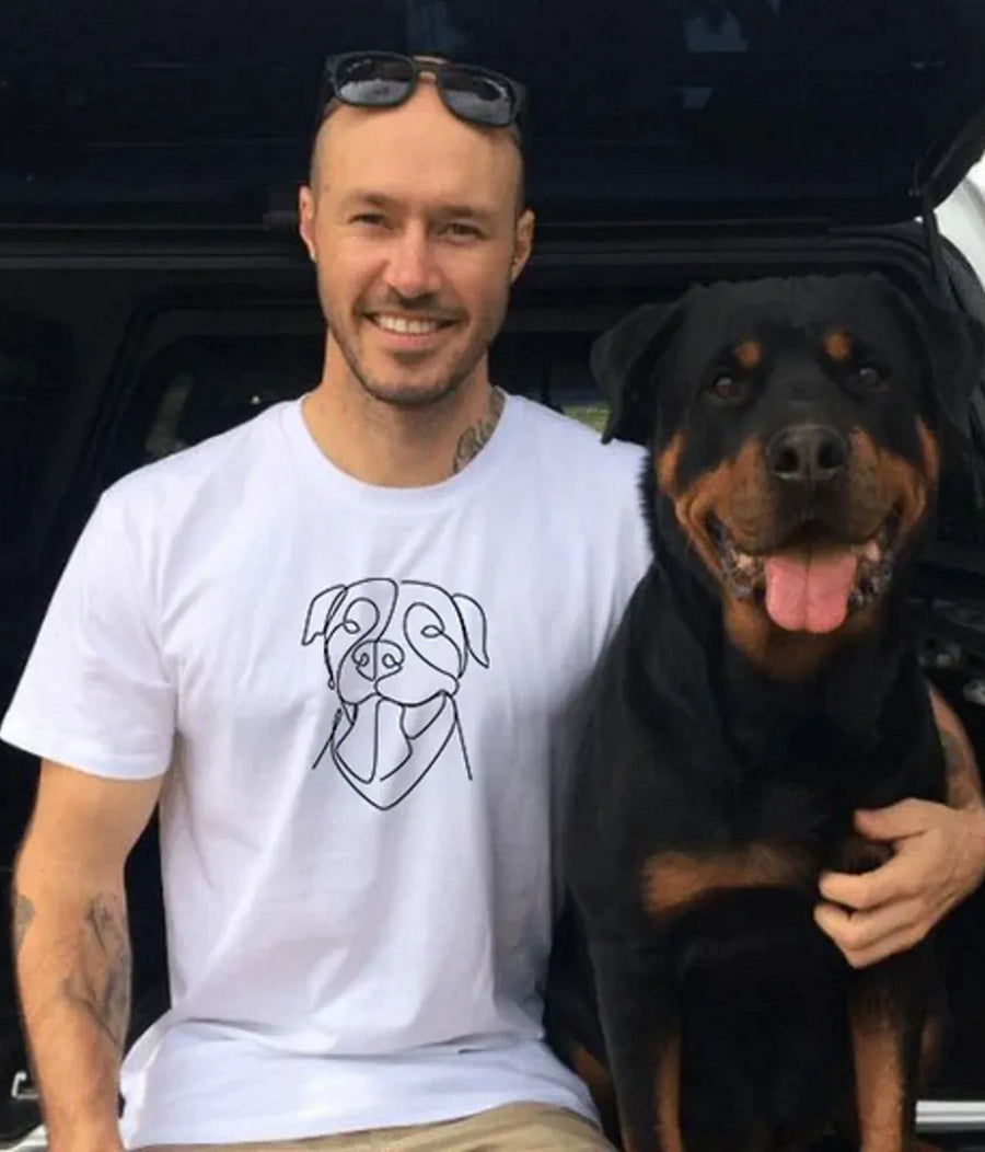 Man with black dog wearing white custom t-shirt with minimalist pet line art (Lovedink)