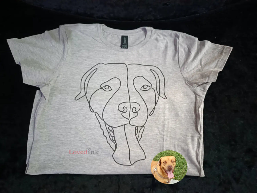 Flat lay of dark custom t-shirt with minimalist line art portrait (Lovedink)