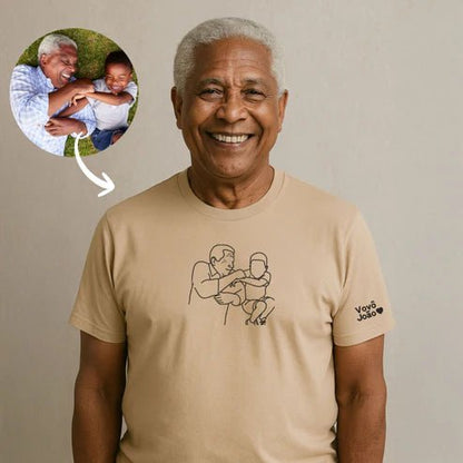 Man wearing a beige t-shirt with a graphic design, smiling, with a small inset showing a related image.